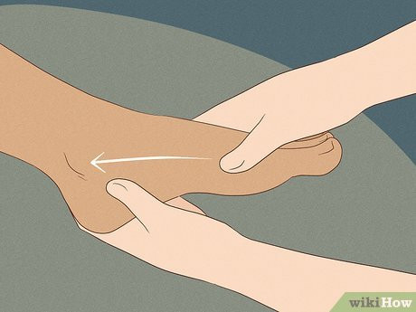 Step 2 Rub the top of her foot with your thumbs.