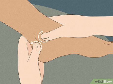 Step 7 Massage her ankle with your thumb and forefinger.
